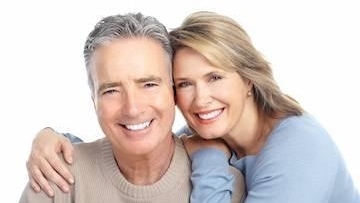 old age couple with white teeth smiling